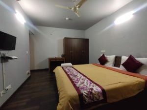 cozy service apartments in hinjewadi pune bedroom yellow